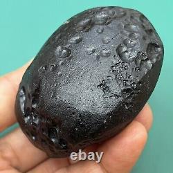 Tektite indochinite space rock impactite of meteorite impact stone 146 g round