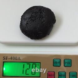 Pierre d'impact de météorite indochinite Tektite space rock 120 g gros rond